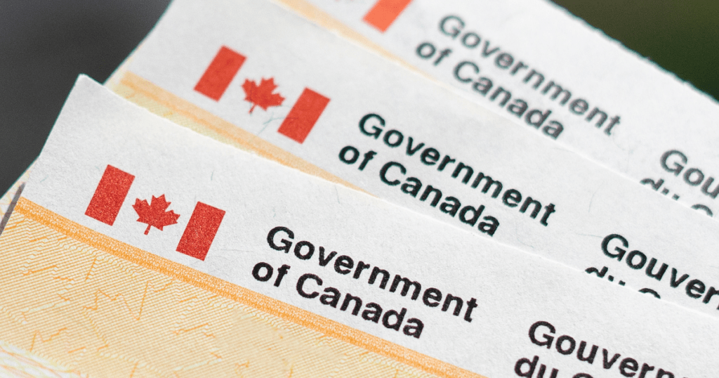 Stack of three cheques from the Government of Canada.