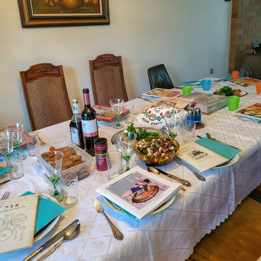 A dining table laid out and ready for the Passover Seder ritual.